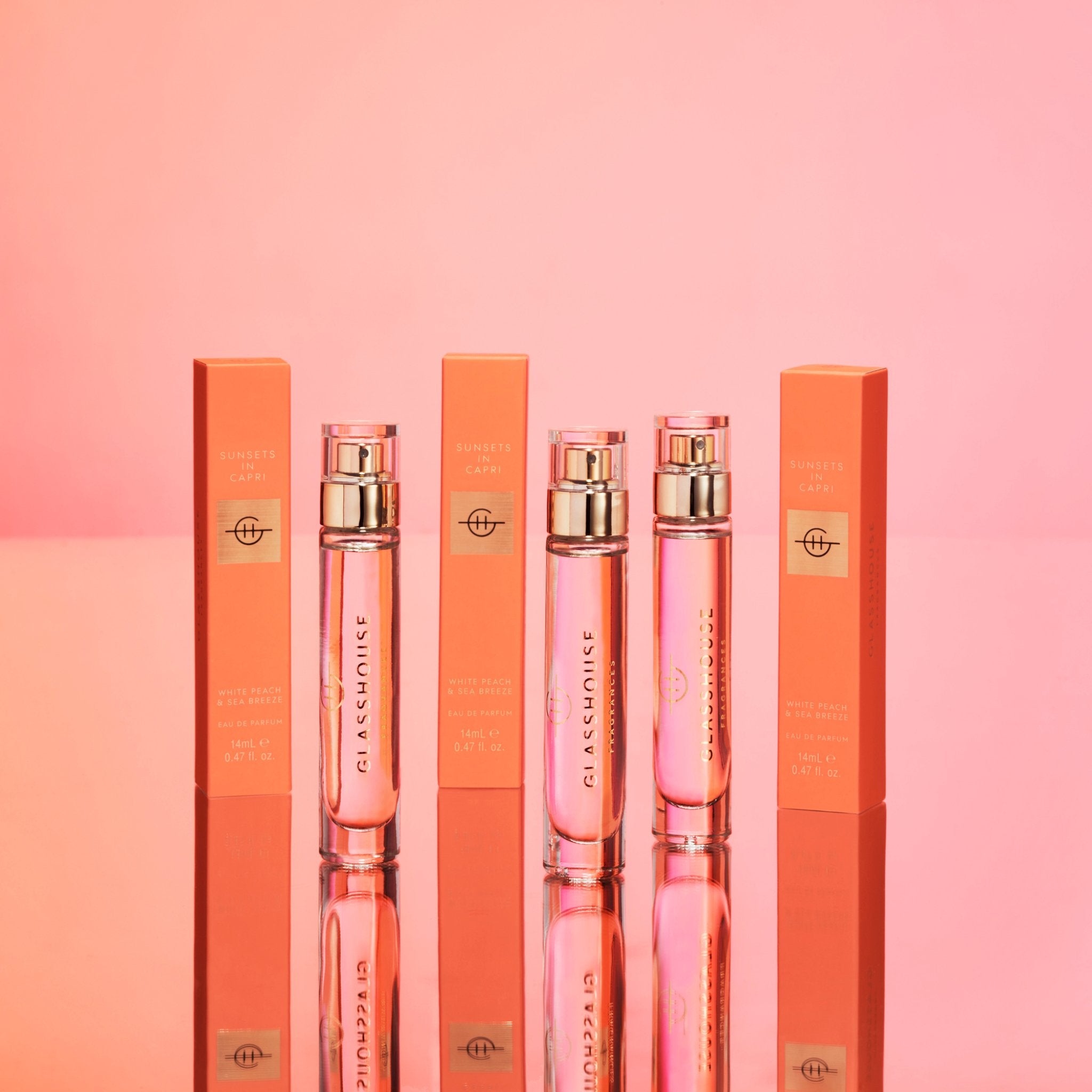 Three bottles and boxes of Sunsets In Capri Eau de Parfum