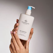 Glasshouse Fragrances The Hamptons Hand Lotion close up in hands.